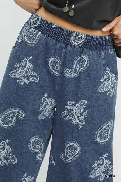 Indigo denim paisley wide-leg pants by Umgee featuring a relaxed fit and stylish pattern, perfect for casual or boho outfits.