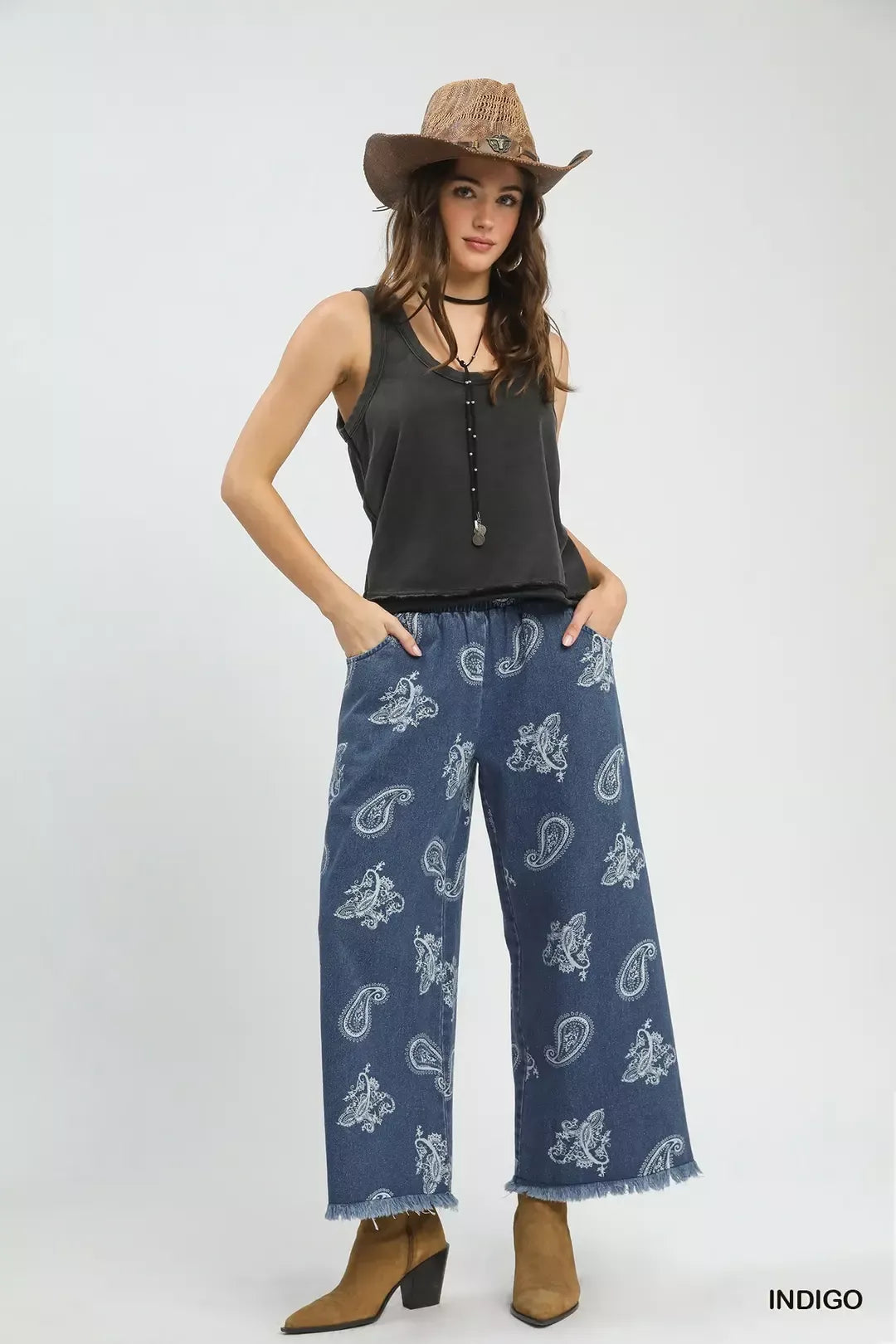 Light indigo Umgee denim wide-leg pants with paisley pattern, featuring a relaxed fit and stylish design.