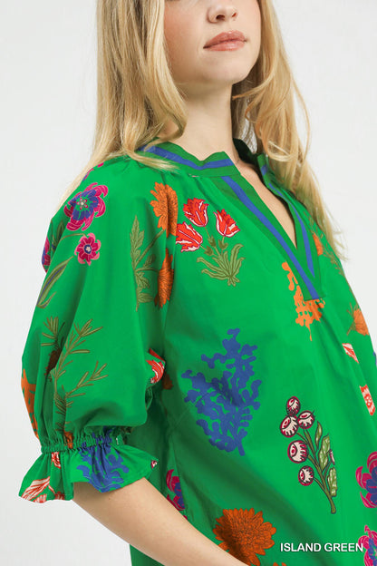 Trendsi Umgee floral split neck puff sleeve top in island green with a relaxed fit and feminine floral pattern.