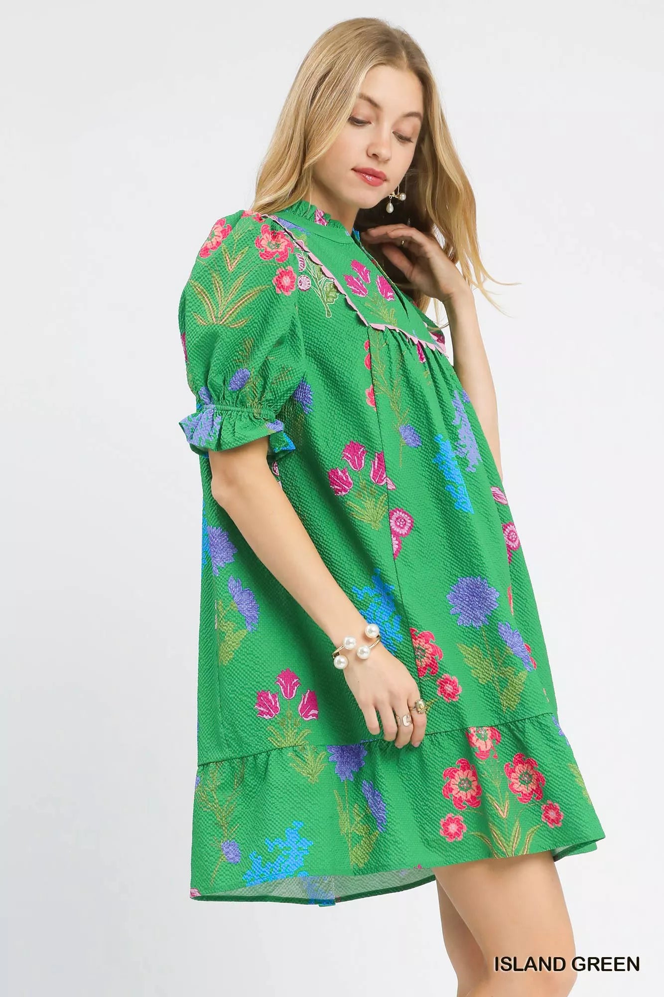 Umgee multi-flower print V-neck dress in island green, featuring a flowing design and floral pattern for a stylish look.