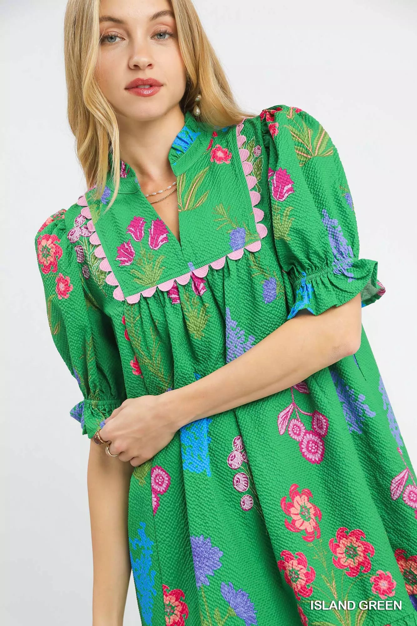 Umgee multi-flower print V-neck dress in island green with short sleeves, perfect for casual or summer wear.