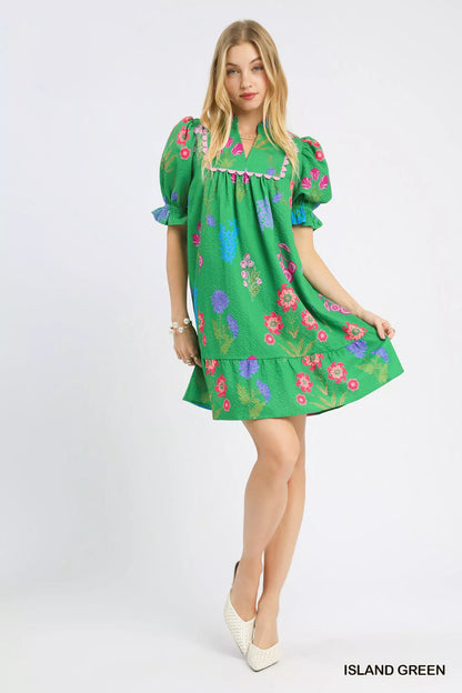 Umgee multi-flower print V-neck dress in island green, featuring a flowy design and vibrant floral pattern.