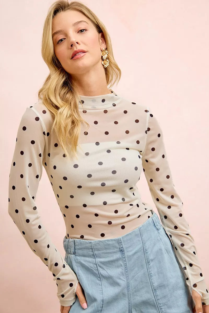 Ivory and black BiBi high neck polka dot mesh top with thumb-open sleeves, stylish and trendy by Trendsi.