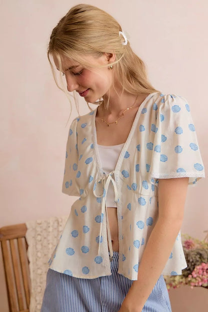 Ivory and blue SO ME shell print blouse top with tie front and flutter sleeves, stylish and lightweight for casual wear.