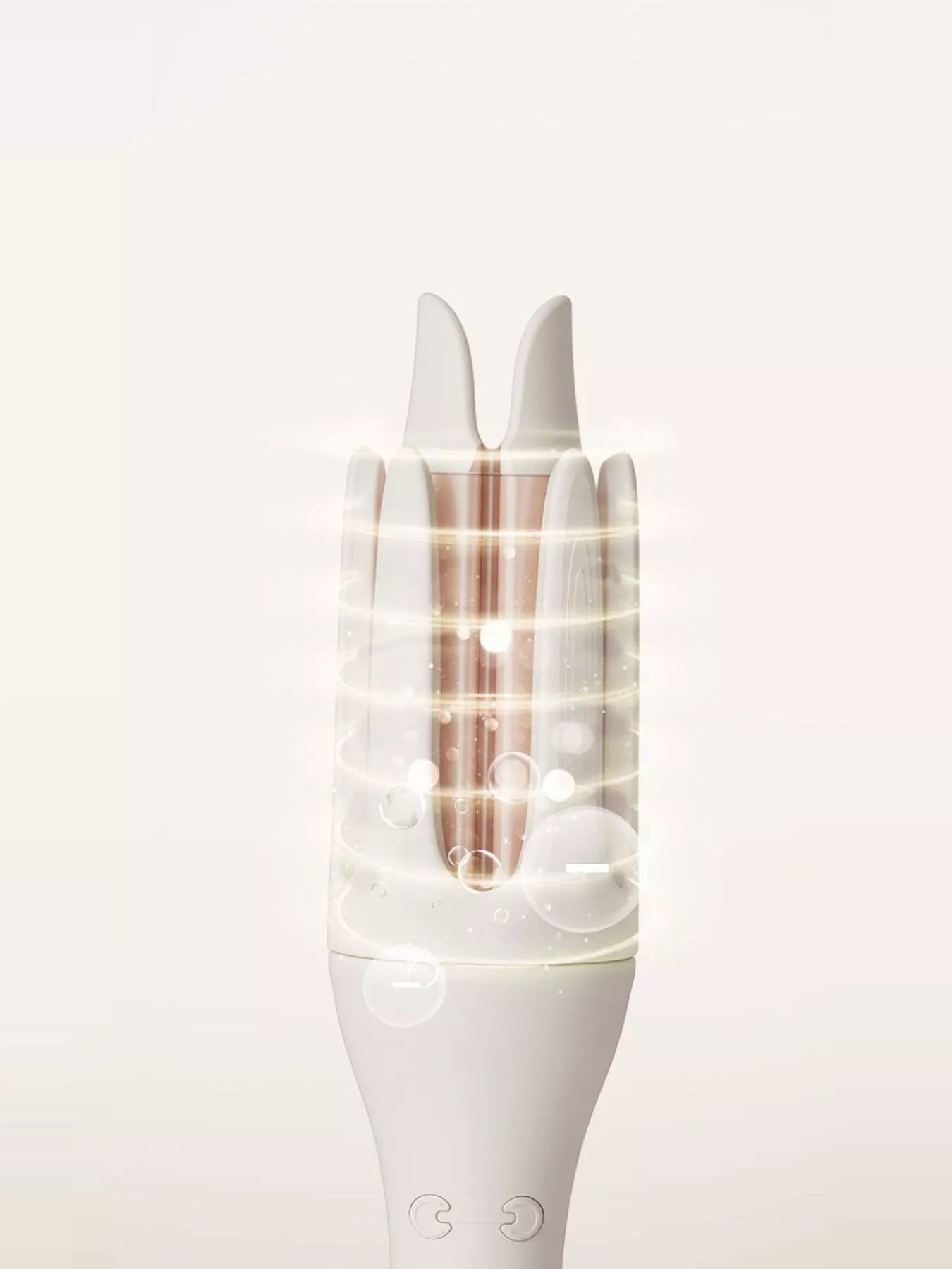 Trendsi automatic rotating ceramic curling iron in ivory with European plug, showing its sleek design and rotating barrel for curls