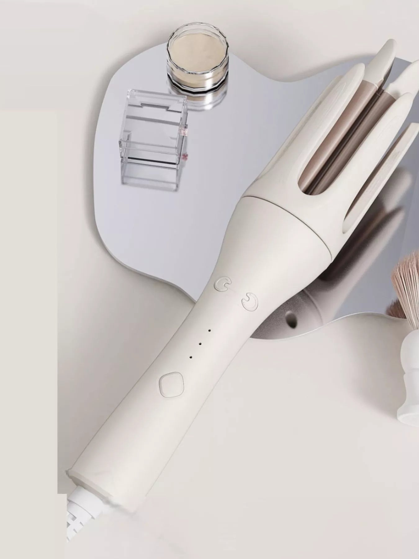 Trendsi automatic rotating ceramic curling iron in ivory with European plug, showcasing its ergonomic design and rotating barrel.