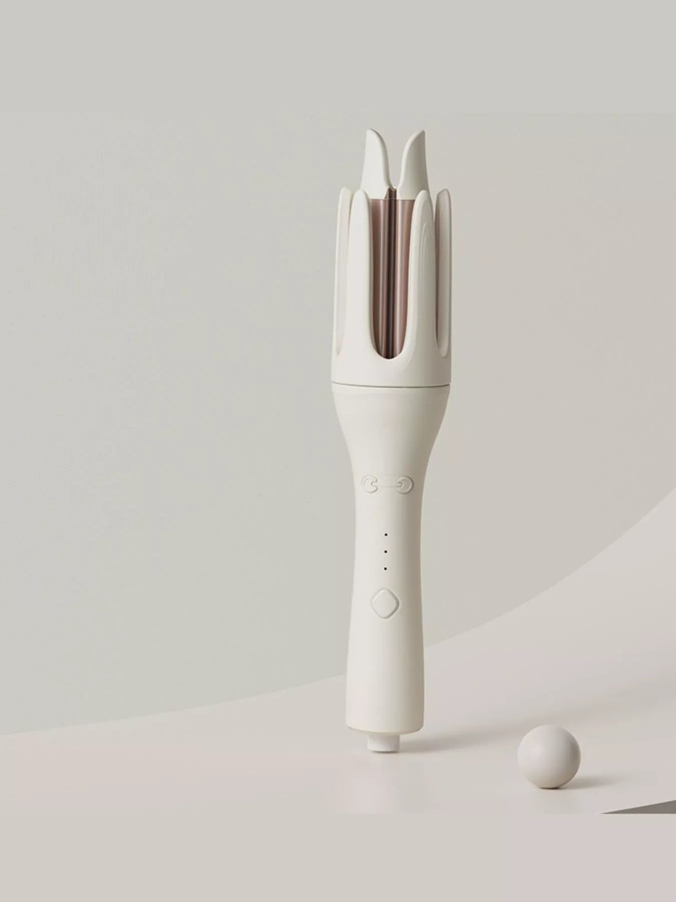 Trendsi automatic rotating ceramic curling iron with ivory finish and European plug for easy, even curling results.