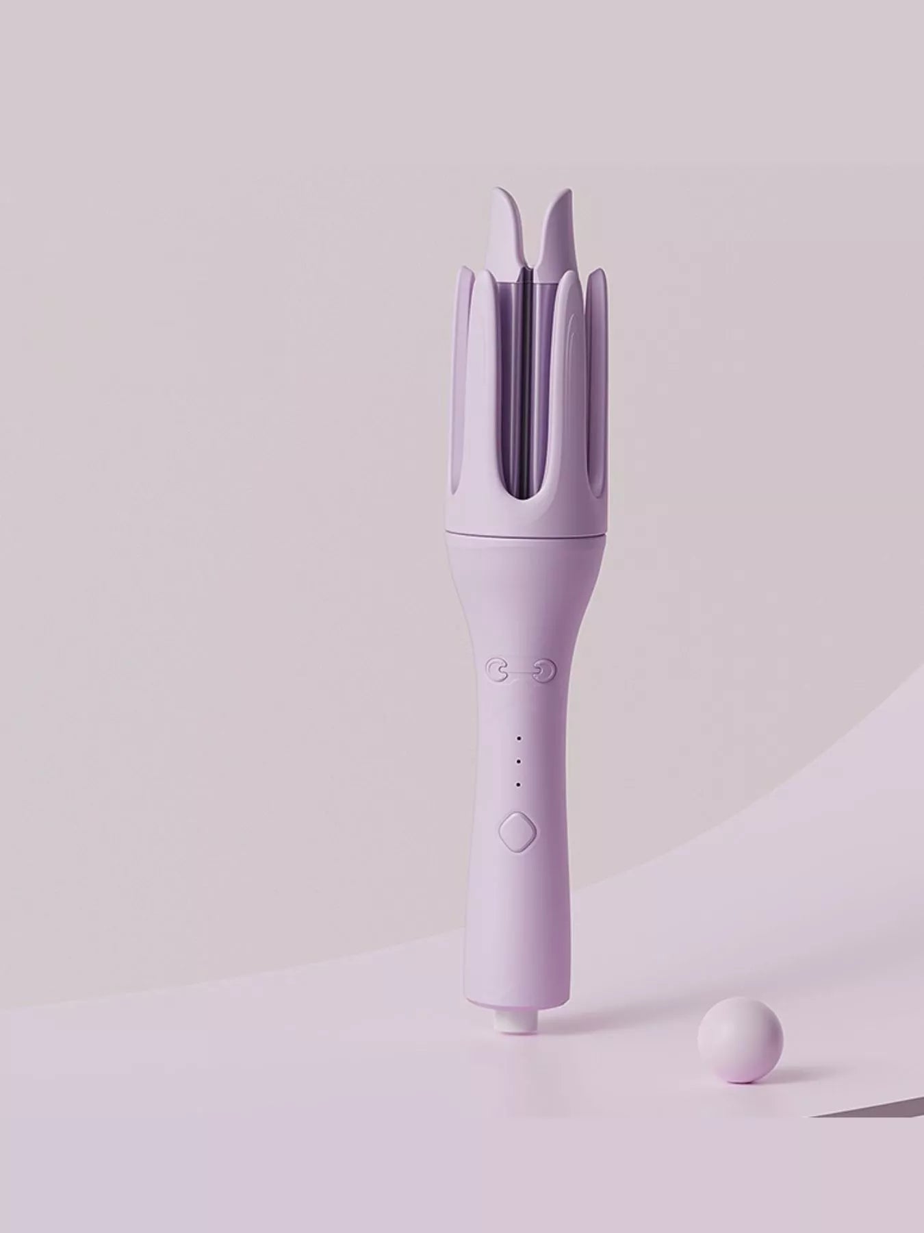 Trendsi automatic rotating ceramic curling iron with ivory finish and European plug, for creating smooth, styled curls.