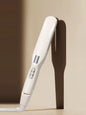 Ivory cordless rechargeable hair straightener by Trendsi with European plug, sleek design, and ceramic plates for smooth styling.