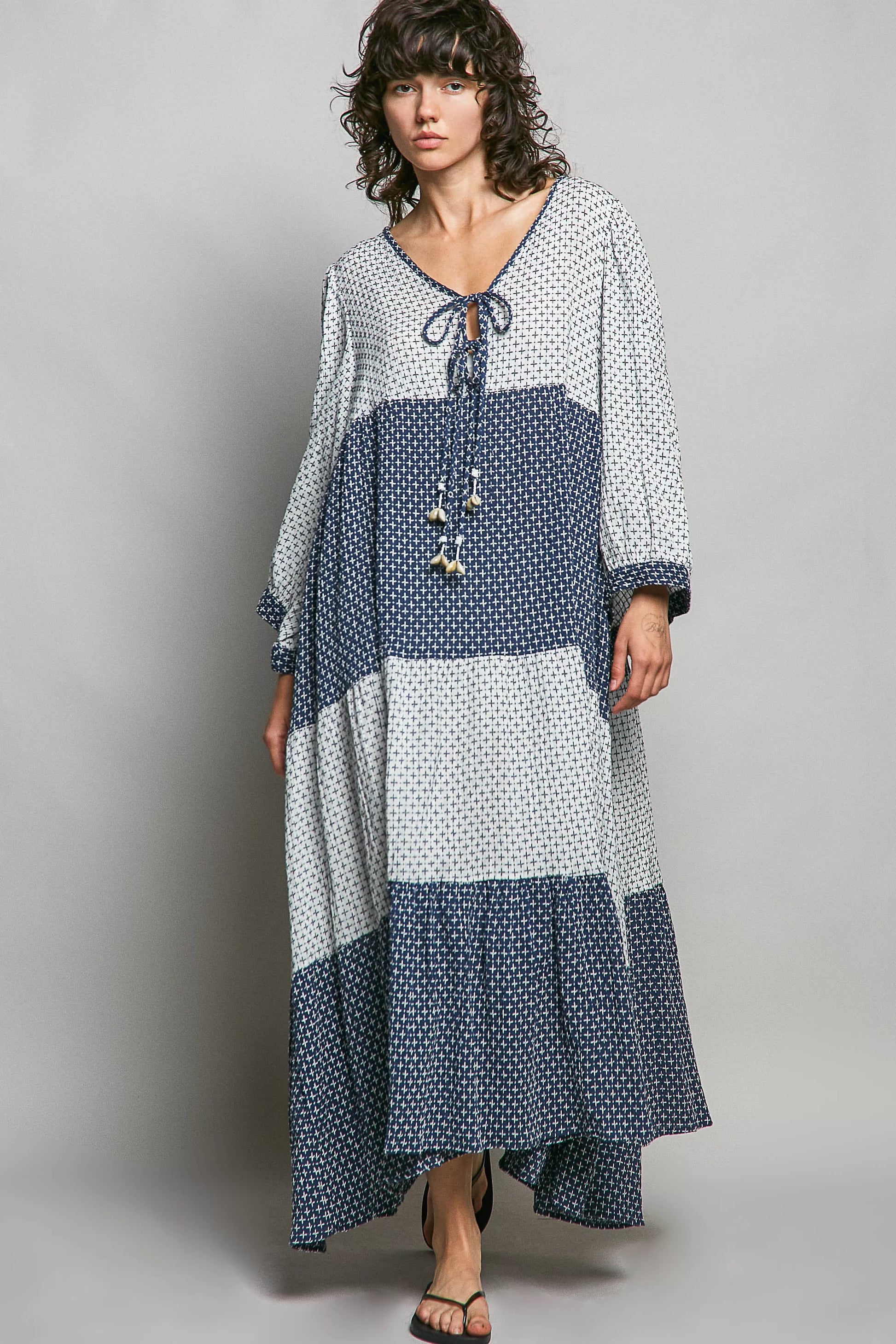 Ivory and indigo tiered boho maxi dress by Trendsi featuring a two-tone design and flowing silhouette.
