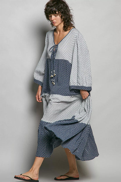 Ivory and indigo tiered boho maxi dress by Trendsi, featuring a two-tone design and flowing, layered silhouette.