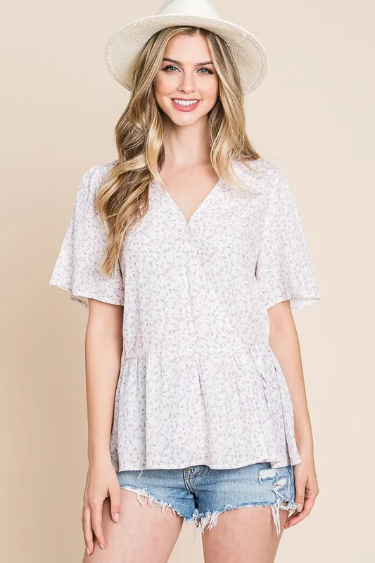 Ivory lavender Lime 'N' Chili ditsy print V-neck short sleeve wrap blouse by Trendsi, styled on a model.