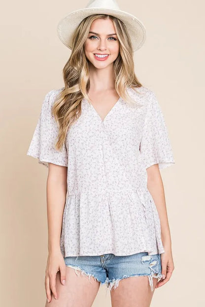 Ivory lavender Lime 'N' Chili ditsy print V-neck short sleeve wrap blouse by Trendsi, styled on a model.