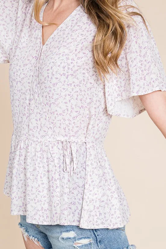 Ivory and lavender Lime 'N' Chili ditsy print V-neck short sleeve wrap blouse by Trendsi, with a relaxed fit and floral pattern.