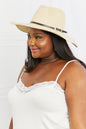 Ivory boho summer straw fedora hat by Trendsi with a wide brim and stylish band, perfect for sunny outdoor wear.
