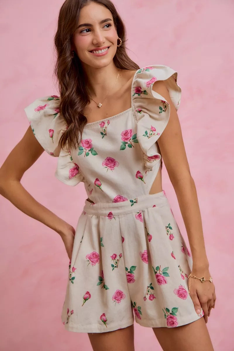 Trendsi ivory pink floral print denim romper with cut-out waist and ruffled details, perfect for casual summer wear.