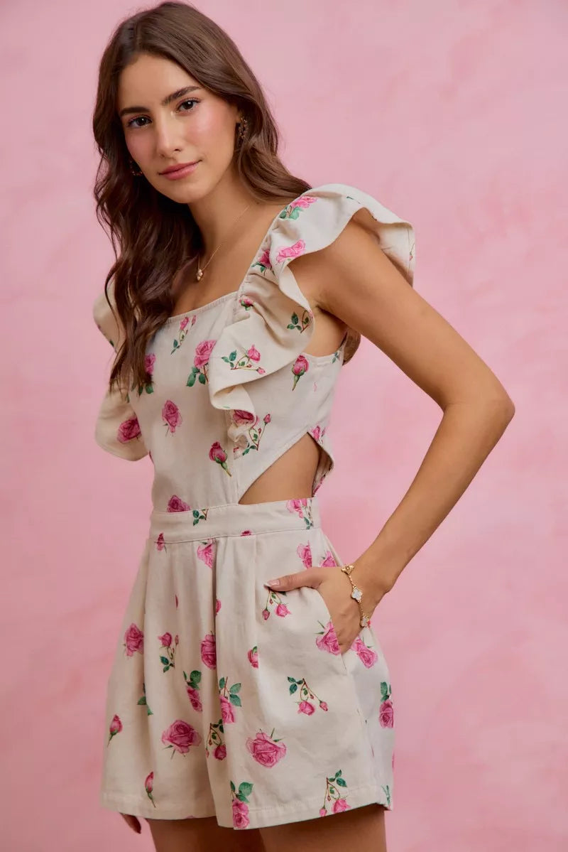 Ivory pink floral print denim romper with cut-out waist and ruffled details, designed by Trendsi, perfect for casual summer wear.