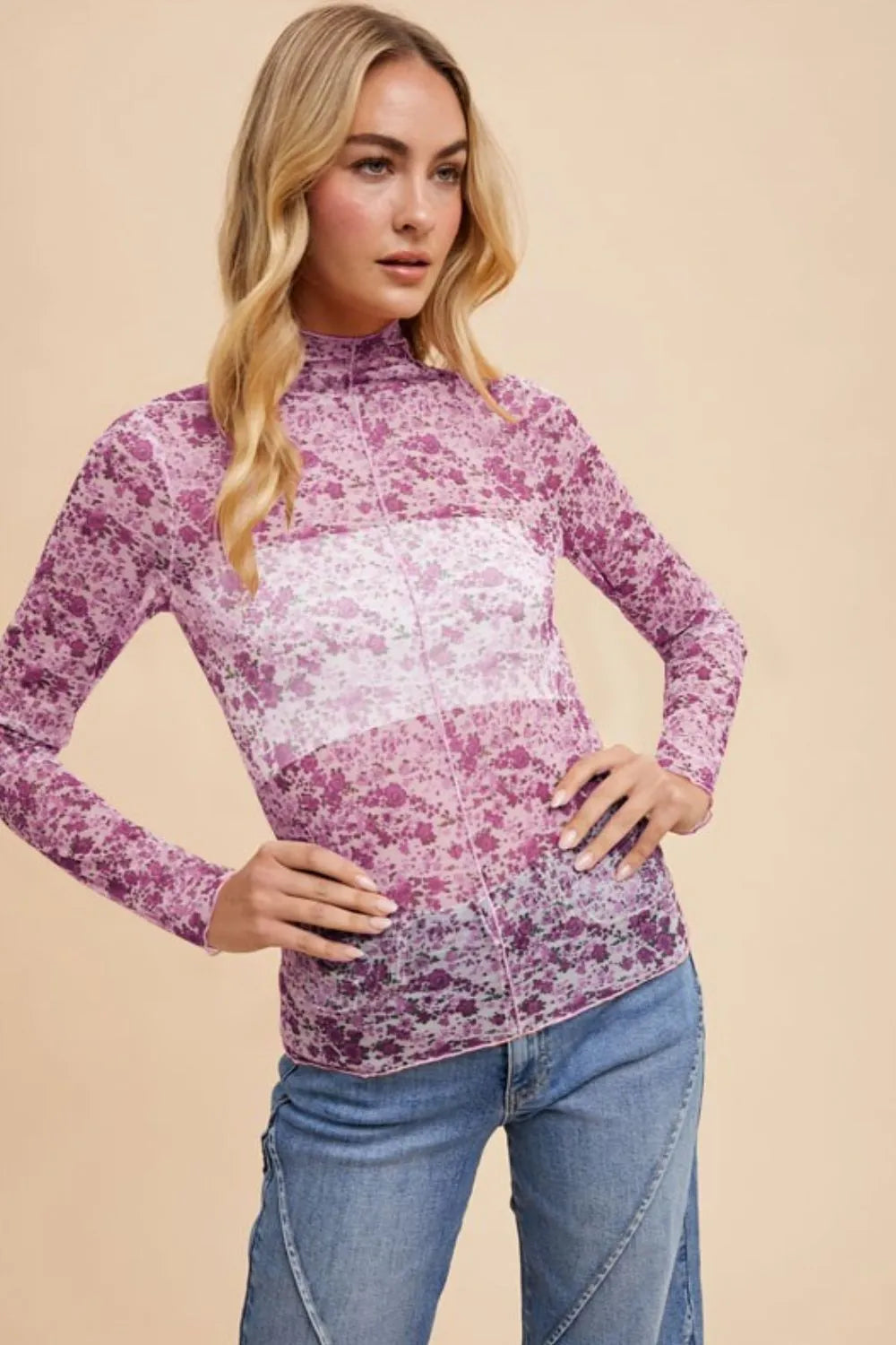 Ivory and purple floral sheer mesh top with lettuce hem by Annie Wear, styled with long sleeves and a lightweight, breathable fabric.