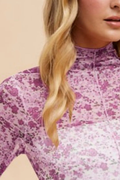 Ivory and purple floral sheer mesh top with lettuce hem by Annie Wear, featuring a lightweight, stylish design.