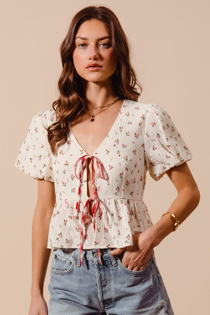 Ivory and red ditsy floral print gauze tie-front blouse from Trendsi, featuring a lightweight, feminine design.