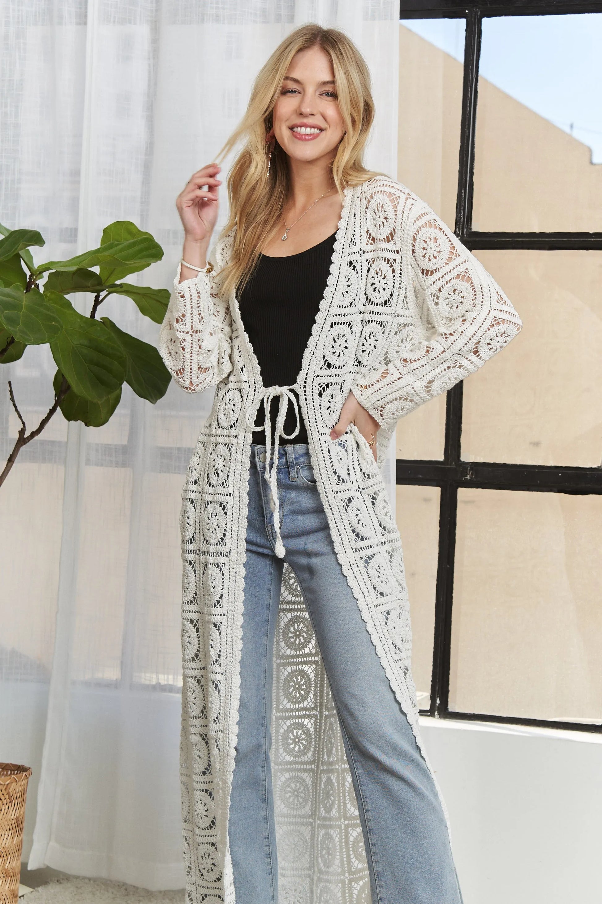 Ivory ADORA long sleeves crochet elastic cardigan by Trendsi, featuring a fitted design and intricate crochet pattern.