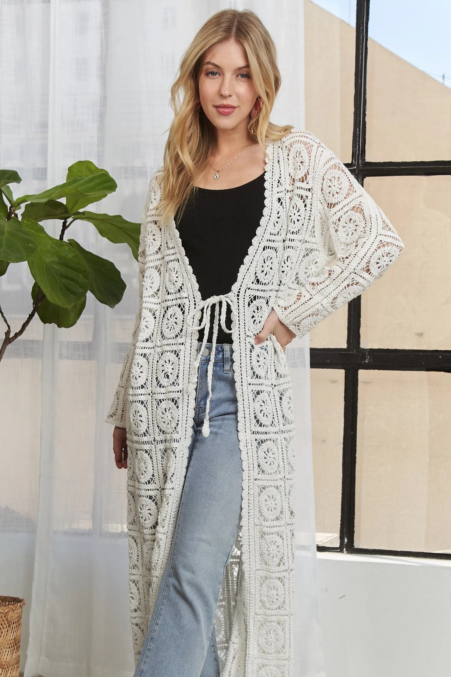 Ivory ADORA long sleeves crochet elastic cardigan by Trendsi, featuring a fitted design with intricate crochet details.