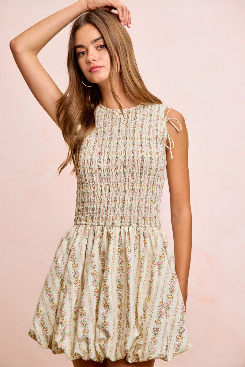 Ivory BiBi floral bow tie dress with attachable puff sleeves by Trendsi, featuring a feminine, flowy design and elegant floral pattern.