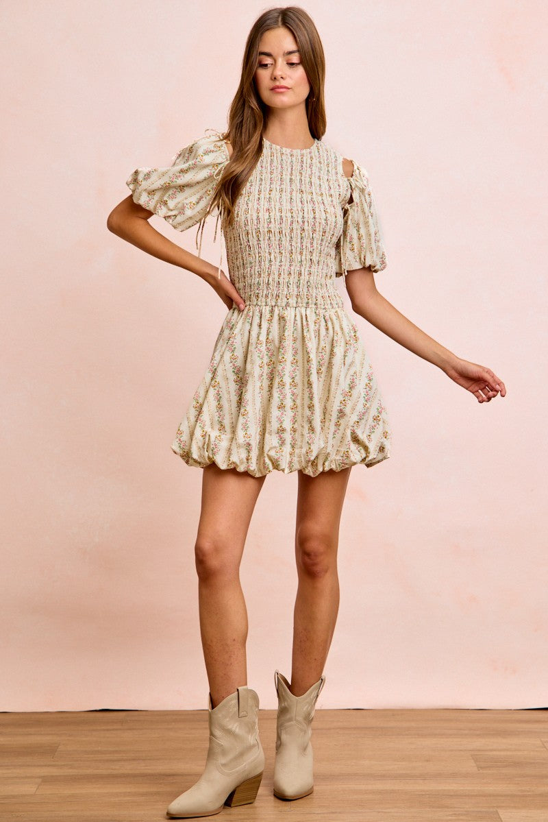 Ivory floral bow tie attachable puff sleeves dress by Trendsi, featuring a feminine design with floral print and puff sleeve details.