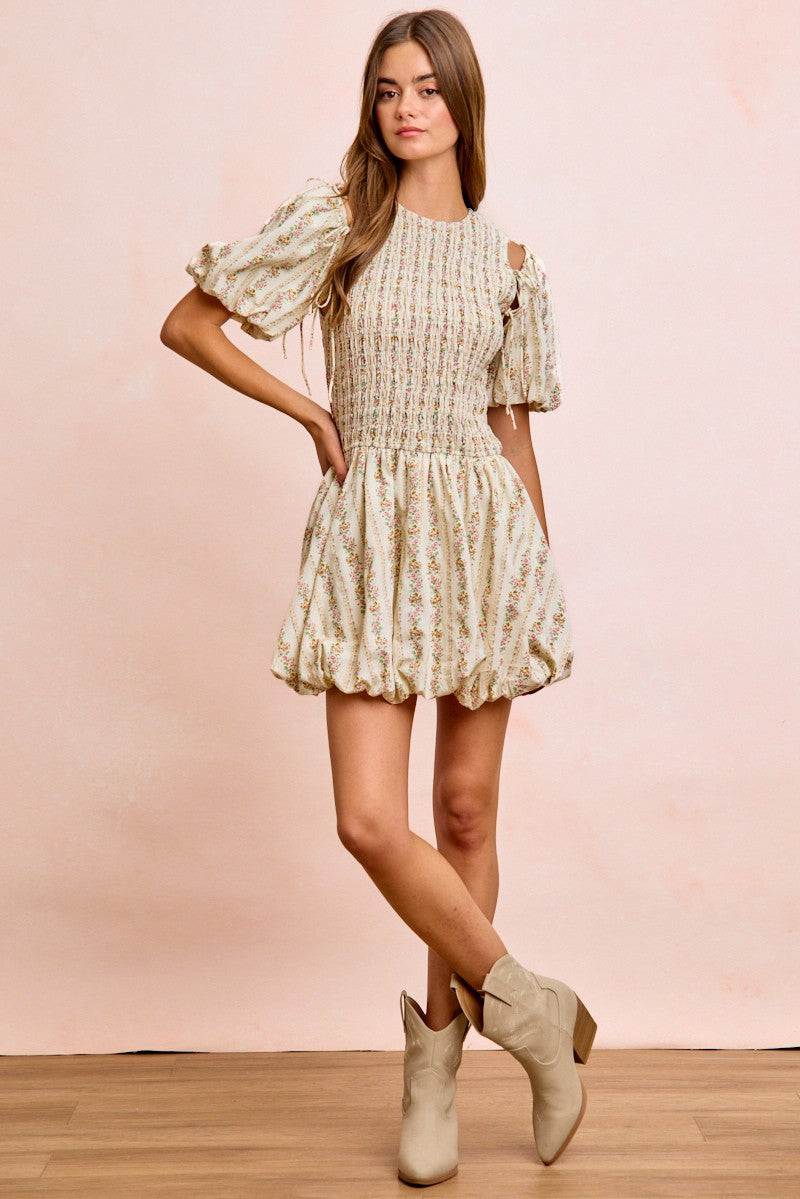 Ivory BiBi floral bow tie attachable puff sleeves dress by Trendsi, featuring a fitted bodice, floral pattern, and elegant puff sleeves.