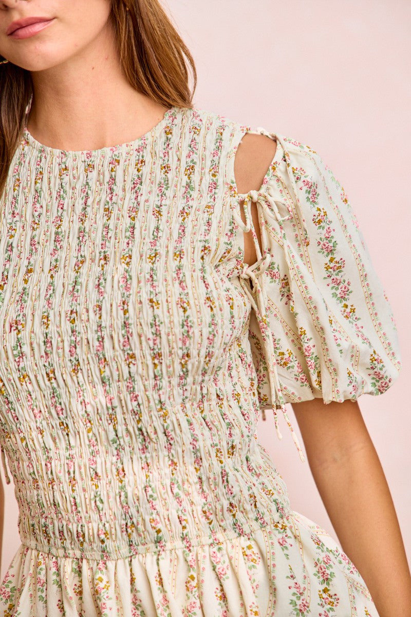 Ivory BiBi floral bow tie attachable puff sleeves dress by Trendsi, featuring a feminine floral pattern and stylish puff sleeves.