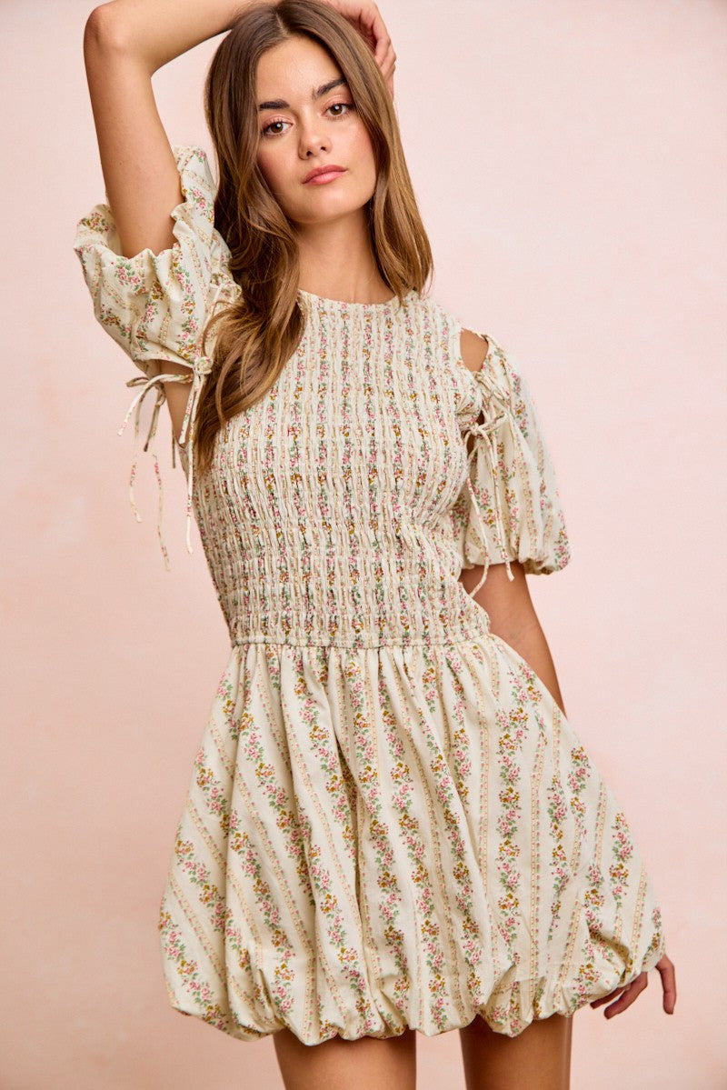 Ivory BiBi floral bow tie attachable puff sleeves dress by Trendsi, featuring a feminine design with floral pattern and puff sleeves.