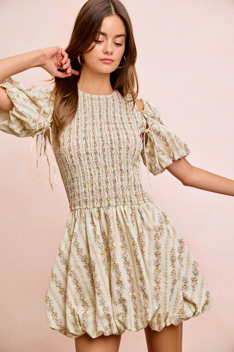 Ivory floral bow tie attachable puff sleeves dress by Trendsi, featuring a fitted bodice and flowy skirt with delicate floral print.