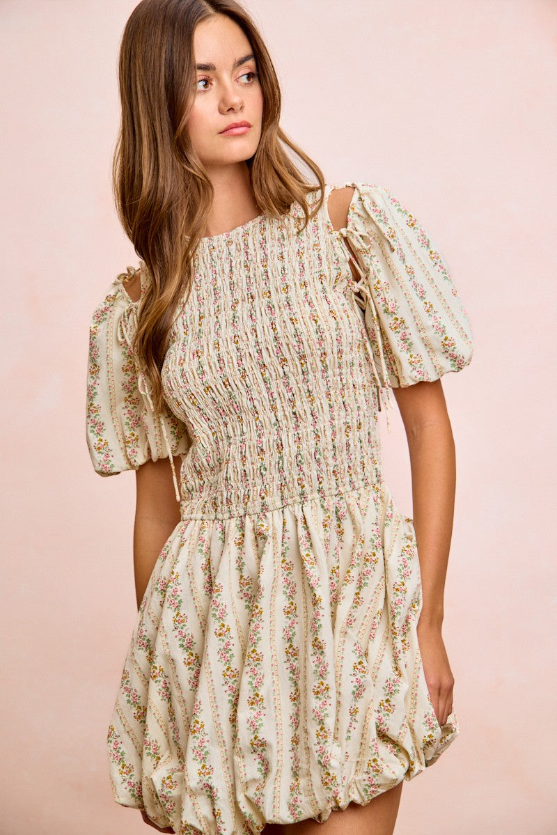 Ivory BiBi Floral Bow Tie Attachable Puff Sleeves Dress by Trendsi, featuring a floral pattern and stylish puff sleeves.
