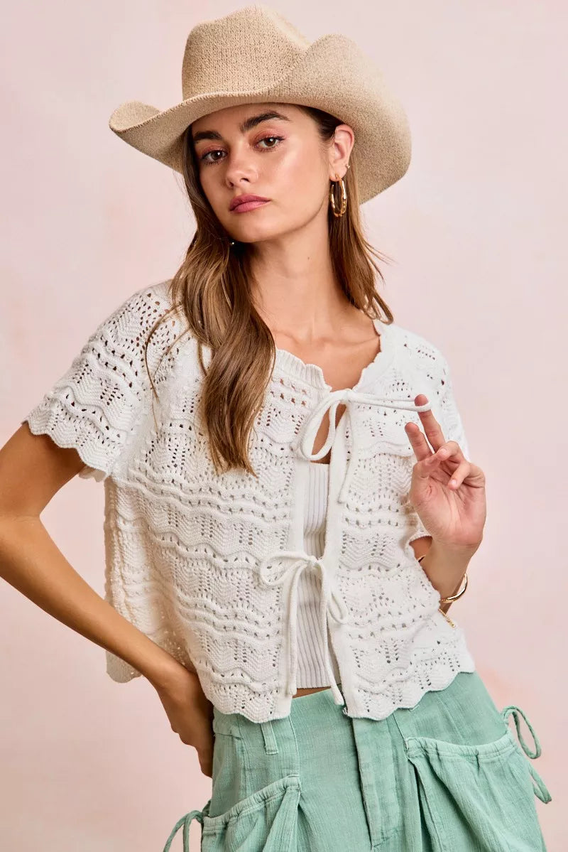 Ivory Trendsi BiBi front bow tie detail pointelle knit top, close-up of the stylish neckline and intricate knit pattern.