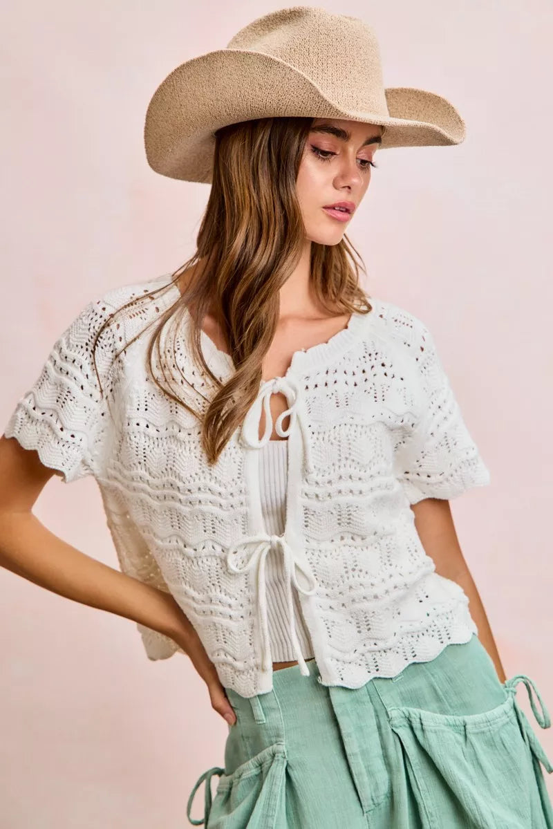 Ivory Trendsi BiBi front bow tie detail pointelle knit top, close-up showing the delicate knit pattern and bow embellishment.