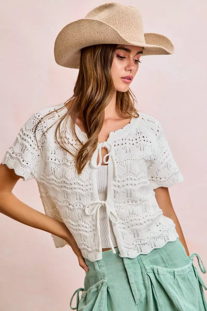 Ivory Trendsi BiBi front bow tie detail pointelle knit top, close-up showing the delicate knit pattern and bow embellishment.