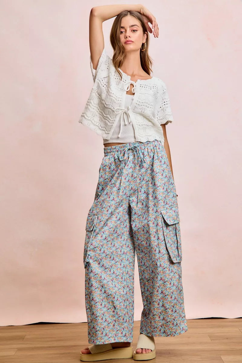 Ivory BiBi front bow tie detail pointelle knit top by Trendsi, showcasing a feminine bow and delicate knit pattern.