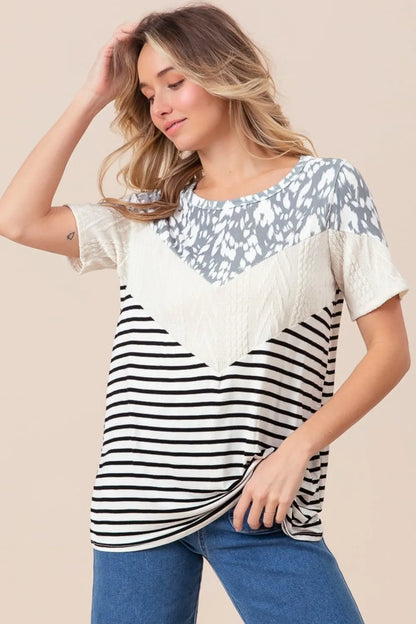 Ivory BiBi printed color block short sleeve T-shirt by Trendsi, featuring vibrant printed design and comfortable fit.