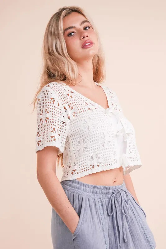 Ivory front tie crochet crop top from Very J by Trendsi, featuring a stylish front tie and intricate crochet design.