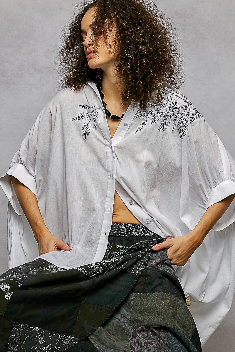 Ivory POL button-down floral embroidered high-low hem shirt by Trendsi, featuring intricate embroidery and a stylish high-low cut.