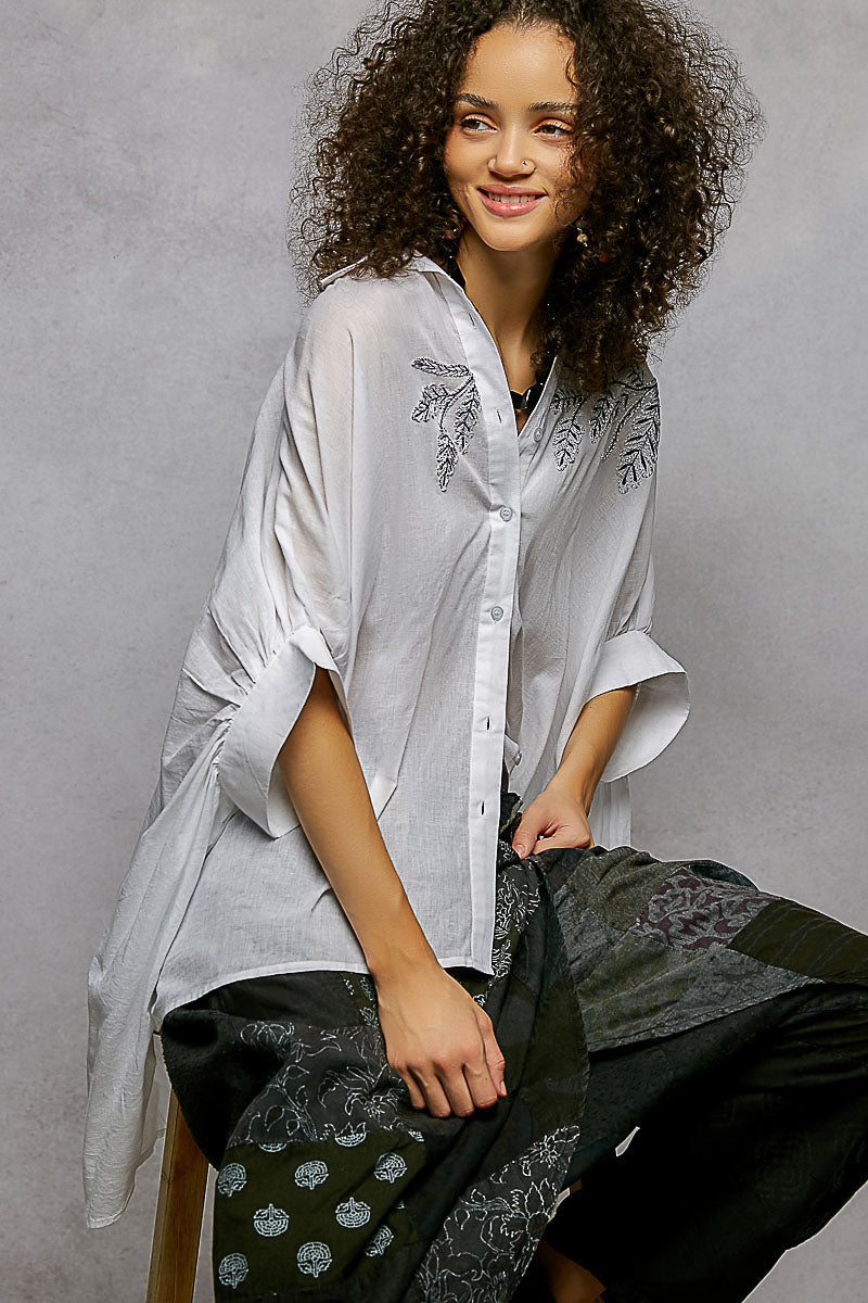 Ivory POL button-down shirt with embroidered floral design and high-low hem, stylish and casual from Trendsi.