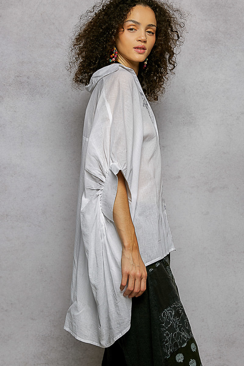Ivory POL button-down shirt with embroidered floral design and high-low hem, stylish high-low hem shirt by Trendsi.