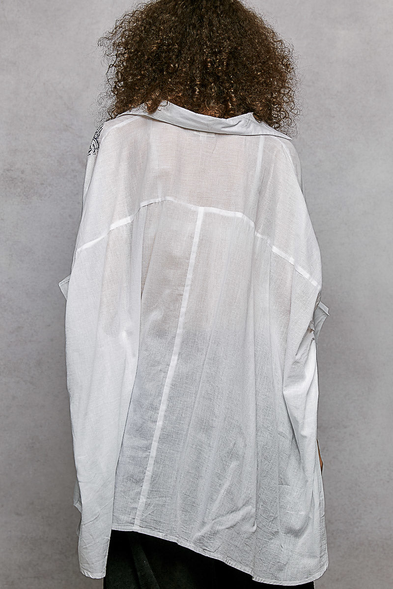 Ivory POL button-down shirt by Trendsi with embroidered floral design and high-low hem, casual and stylish for everyday wear.