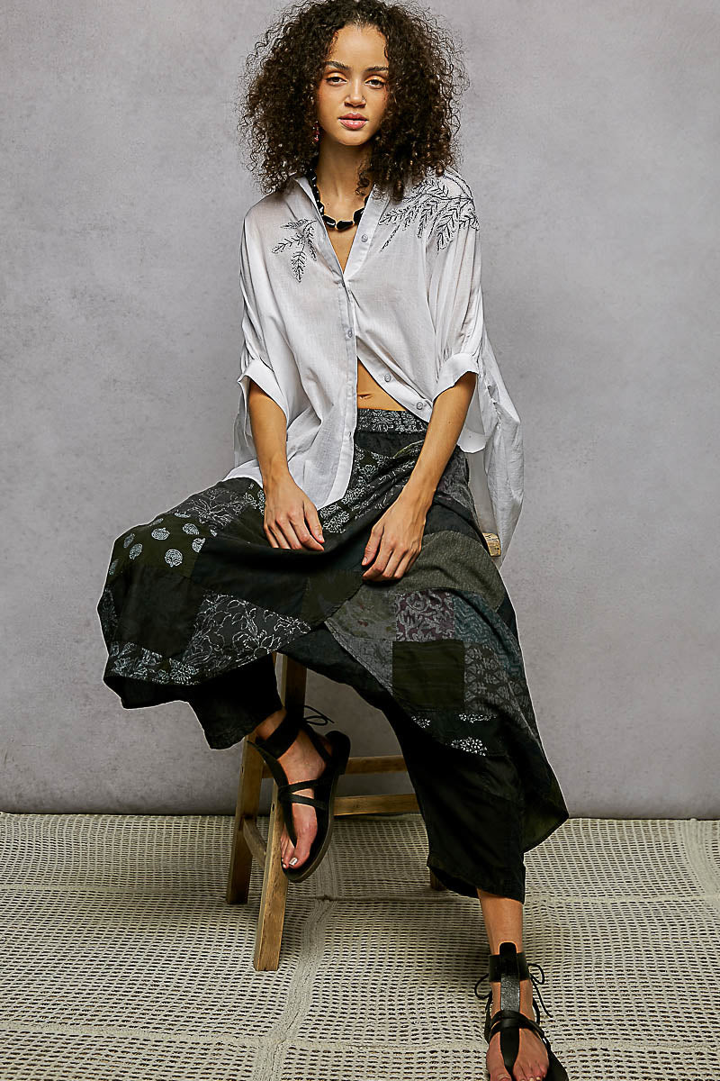 Ivory POL button-down embroidered floral high-low hem shirt by Trendsi, featuring intricate floral embroidery and stylish design.