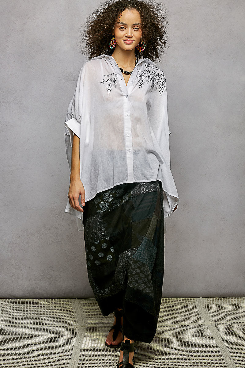 Ivory POL button-down shirt with embroidered floral design and high-low hem, stylish casual top by Trendsi.