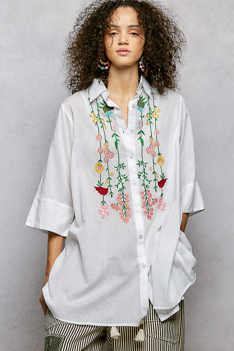 Ivory floral embroidered cotton half-sleeve shirt by Trendsi, showcasing intricate embroidery and lightweight fabric.