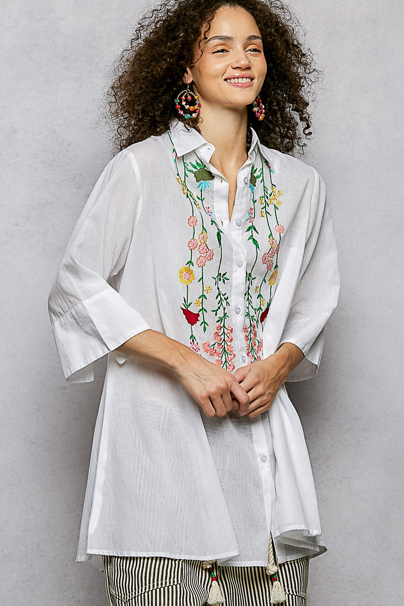 Ivory floral embroidered half sleeve cotton shirt by Trendsi, close-up of embroidered floral details on lightweight fabric.