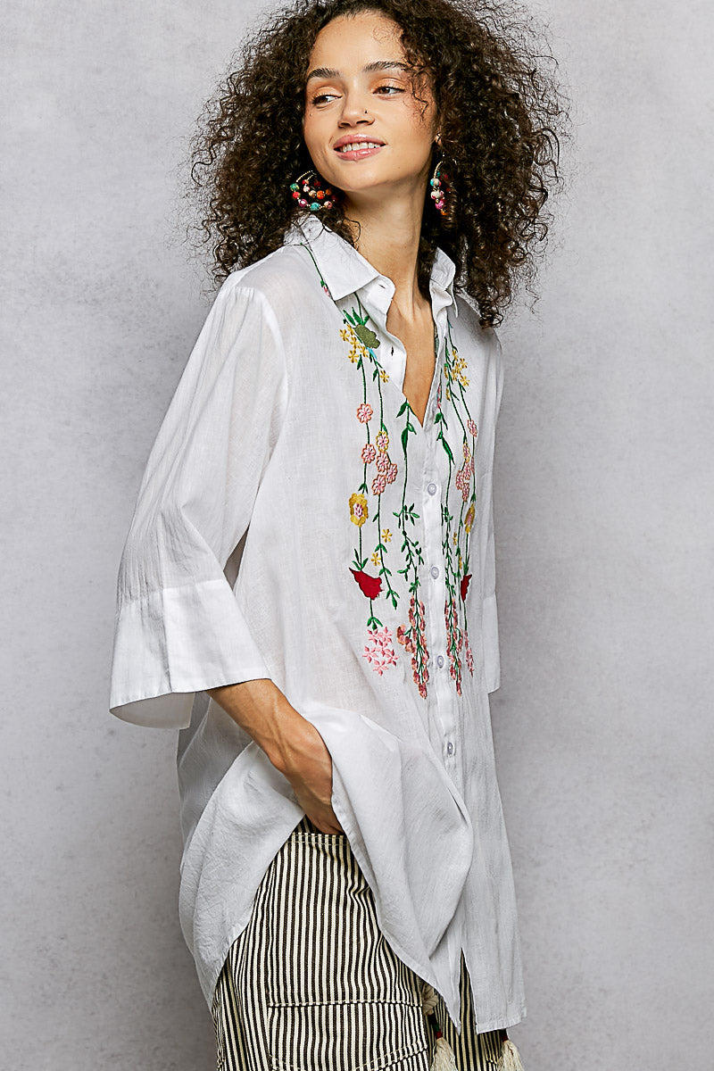 Ivory floral embroidered cotton shirt with half sleeves by Trendsi, displayed on a model showing front view.