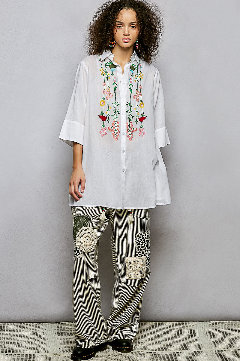 Ivory floral embroidered half-sleeve cotton shirt by Trendsi, featuring delicate embroidery and lightweight fabric.