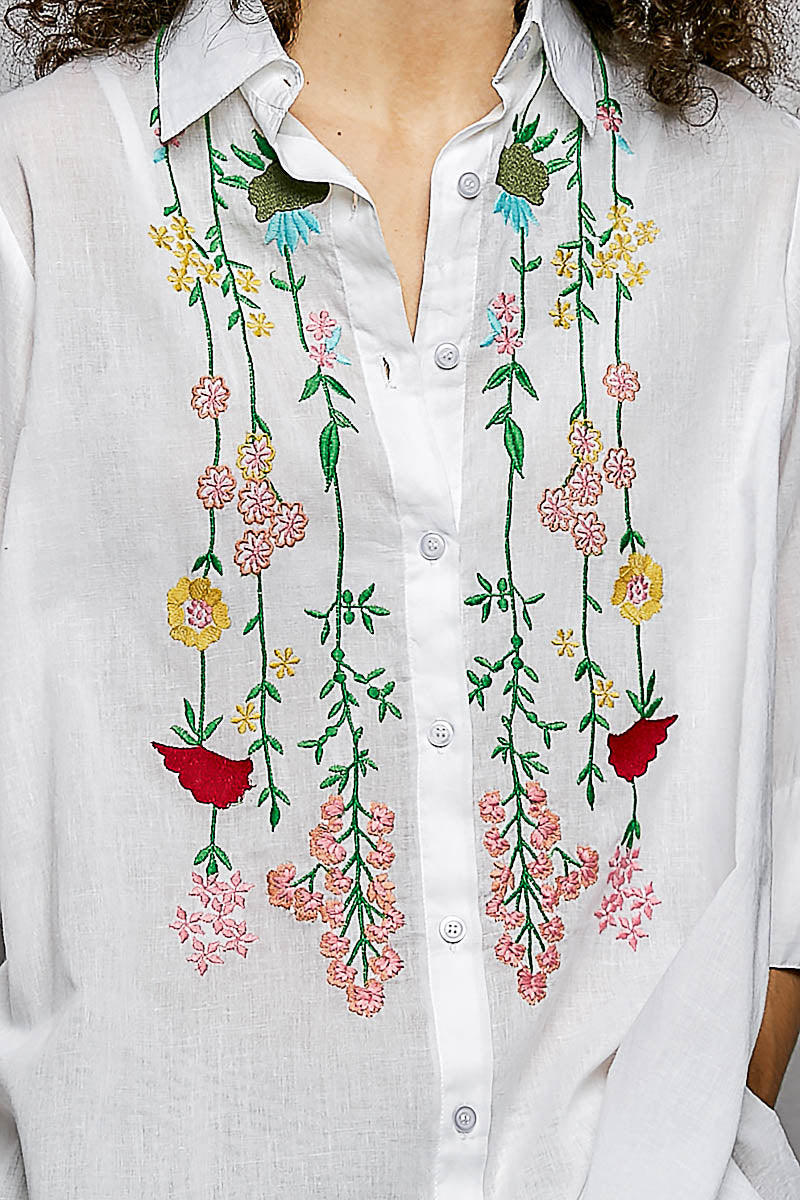 Ivory floral embroidered half-sleeve cotton shirt by Trendsi, featuring intricate embroidery and a relaxed fit.
